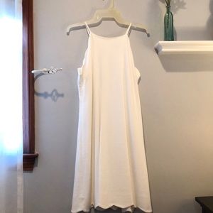 White swing dress with scalloped edges